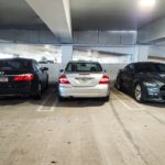 A group of cars parked in a parking garage